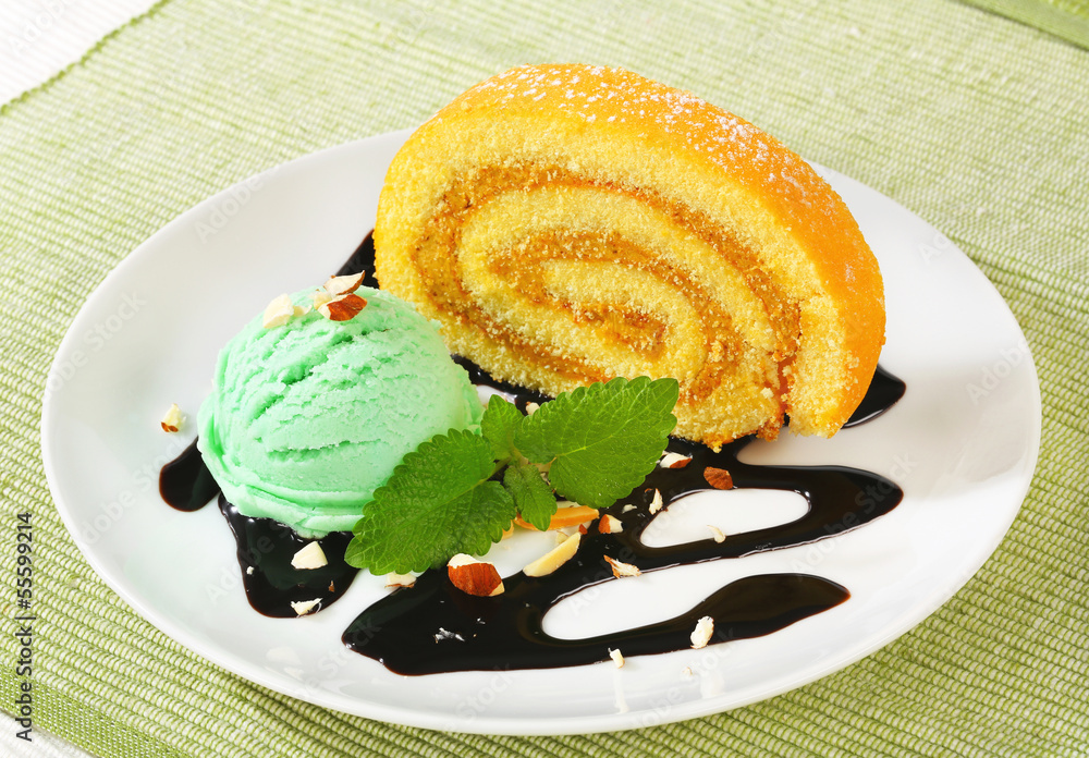 Wall mural swiss roll with scoop of green sherbet