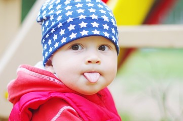 baby puts out tongue