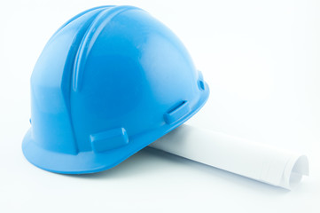 Blue hardhat on papers