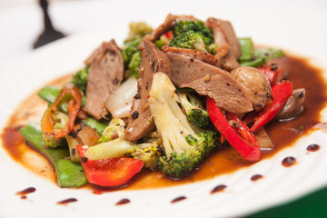 Stir fried grill duck with black pepper.
