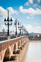 Old bridge in Bordeaux, France - obrazy, fototapety, plakaty