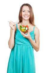 woman holding plate of fresh vegetables
