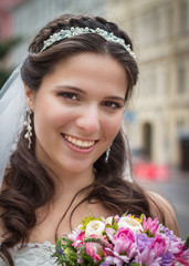 Happy bride with bouquet