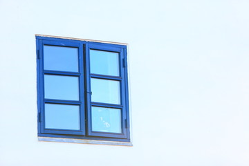 blue old window on white wall architecture detail