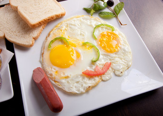 breakfast with fried eggs, toasts and juice