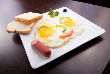 Fried eggs, toasts and Sausage