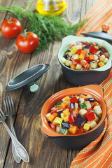 Steamed vegetables in pots portioned