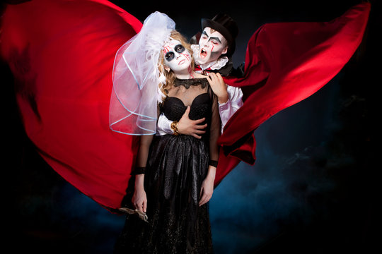 man and woman  wearing  as  vampire and dead bride. Halloween