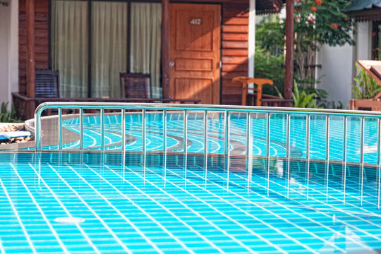  pool near a bungalow in tropical hotel, Thailand