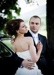 Bride and groom in car