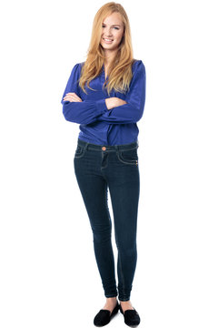 Trendy woman standing with folded arms