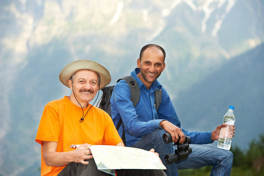 smiling tourist hiker in india mountains