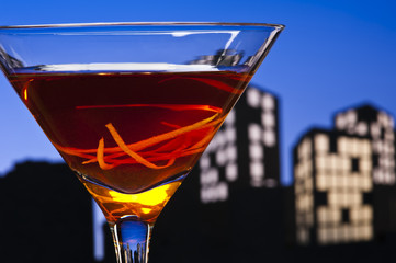 Metropolis Manhattan cocktail in city skyline setting