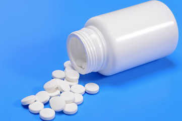 Capsules spilling from a medicine bottle