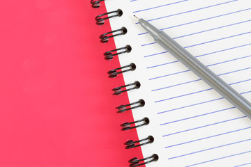 notebook and pen on white background