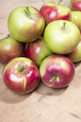 pile of apples on a wooden background