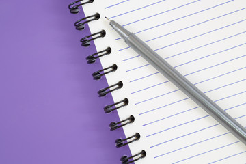 notebook and pen on white background