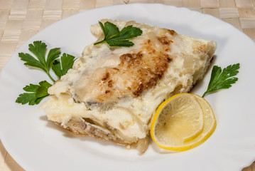 fish baked under cheese