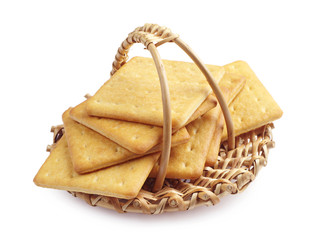 Rectangle cheese crackers in a wicker basket