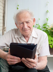 senior man with a touchpad PC