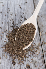 Caraway on a wooden spoon