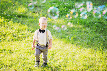 boy playing with soap bubbles