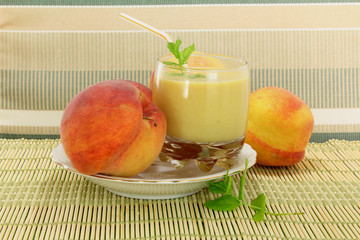 peach milkshake with fruit in plate