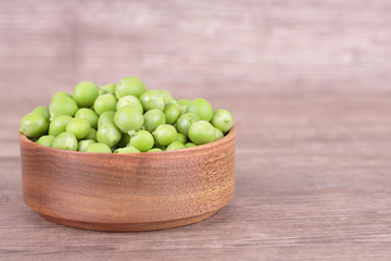 peas in a wooden bowl