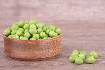 peas in a wooden bowl