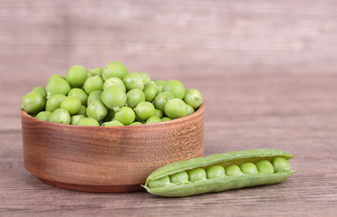 peas in a wooden bowl