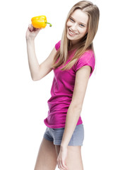 young beautiful blond woman holding yellow papper