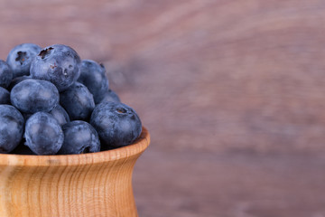 blueberries in wooden bowl