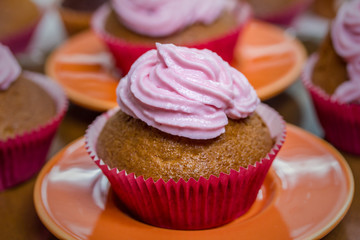 pink decorated tartlets on a table