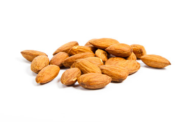 Heap of almond nuts isolated on white background