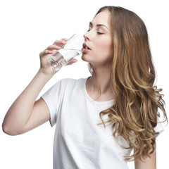 young beautiful brunette woman drinking water
