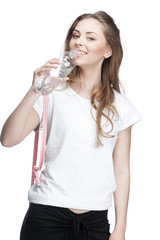 young beautiful brunette woman drinking water