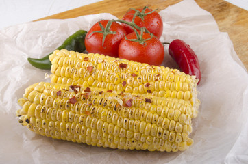 grilled corn on the cob and tomato © Szakaly
