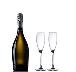 Bottle of champagne with empty glases