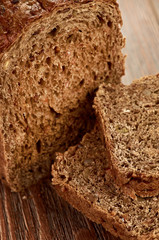 Slices of brown bread on a wooden table
