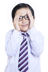 Shy expression of business kid - isolated