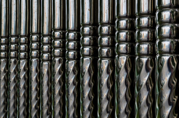Texture long shiny metal pipes closeup, background