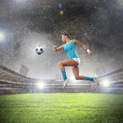 Naklejka premium Young woman football player