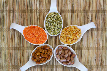 Selection of pulses on porcelain spoons