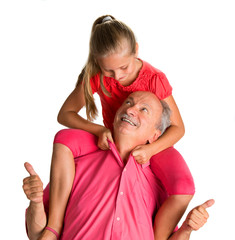 Portrait of a little girl enjoying piggyback ride with her grand