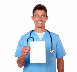 Young male nurse holding a blank card