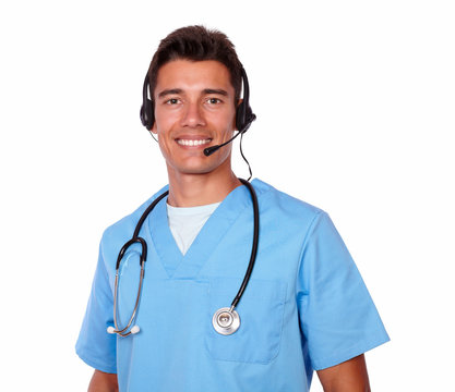 Handsome Young Nurse Conversing On Headphones