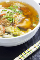 Soup with sliced pork and dumplings