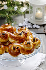 Traditional swedish buns in christmas setting. A saffron bun