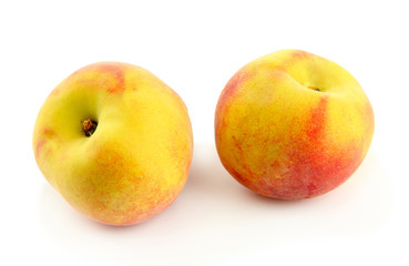 Ripe sweet peaches, isolated on white