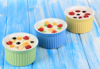 Delicious yogurt with fruit on table close-up